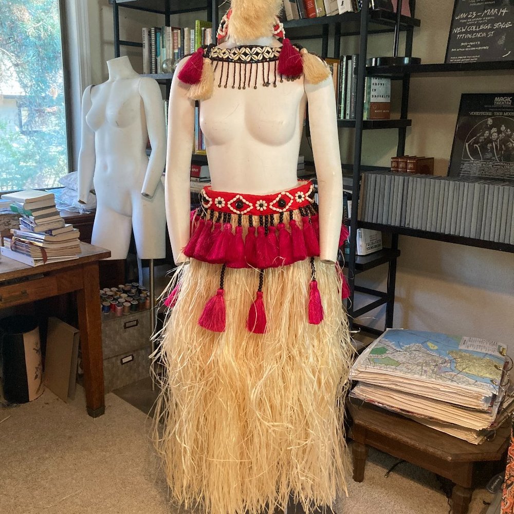 Grass skirt, headpiece, cowrie shell accessory, hand tassels